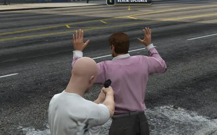 An NPC raises his hands at gunpoint